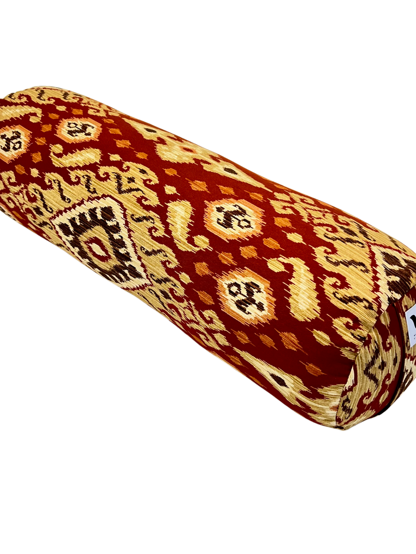 Round yoga bolster in Red and Gold Ikat Print. Cotton canvas removeable cover. Handcrafted in Calgary Alberta Canada