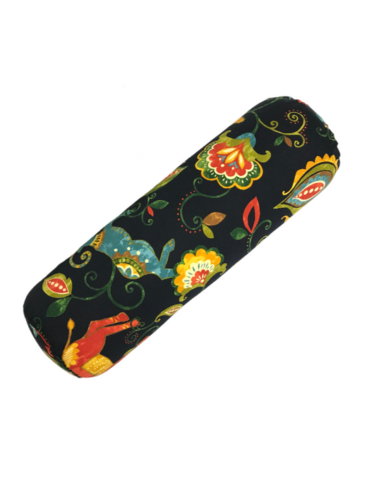 Round yoga bolster with black background and bright multi colour print of floral and animals. handcrafted by Yoga Room Elements