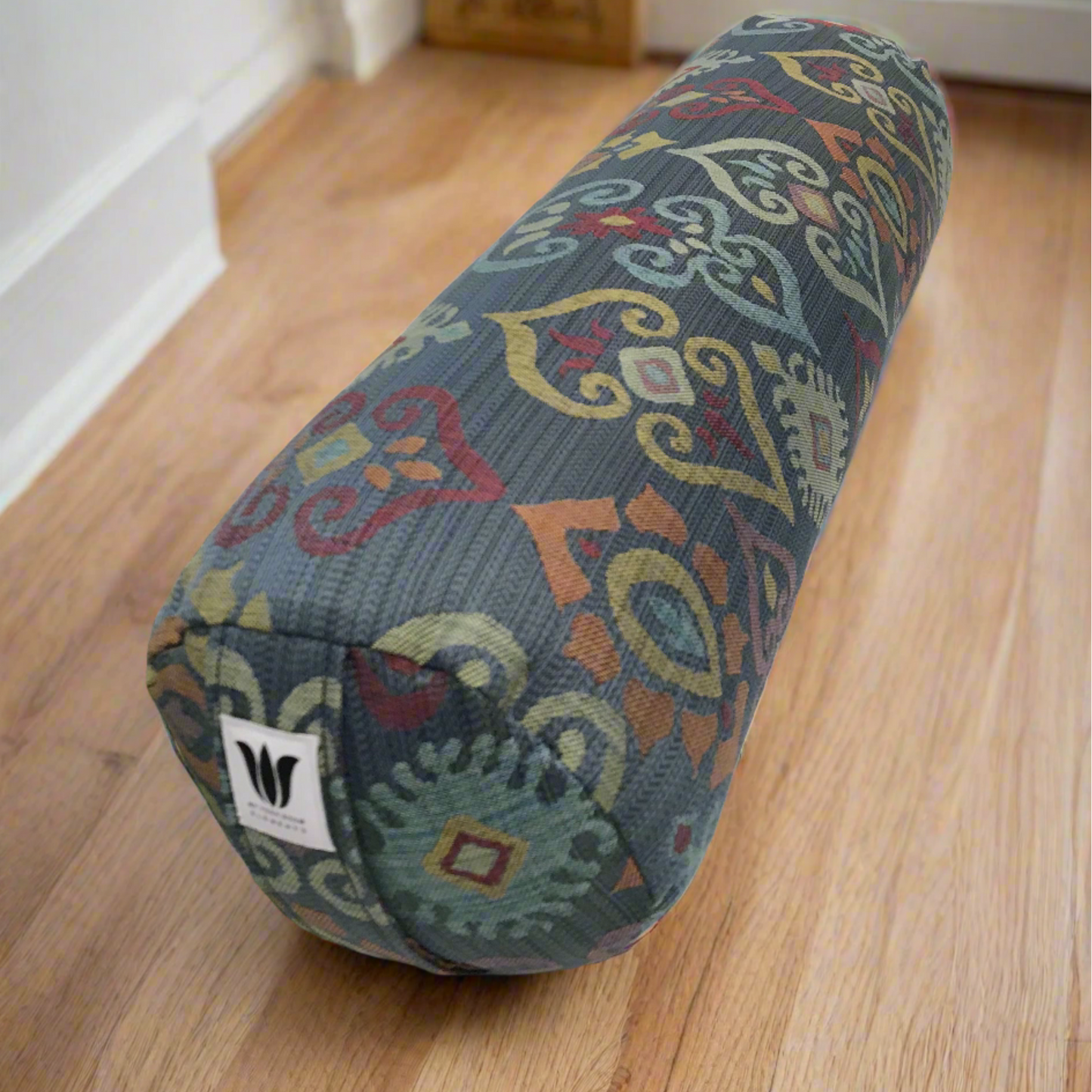 Round yoga bolster made in canada slate blue background with rainbow color print