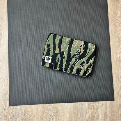 Fabric covered foam block for use in yoga, pilates, fitness workouts to ground, support and pad the body.