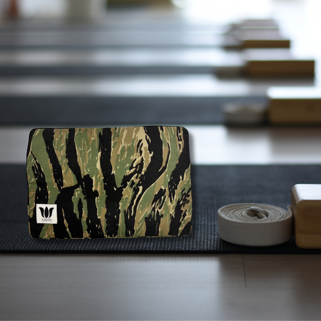 Fabric covered foam block for use in yoga, pilates, fitness workouts to ground, support and pad the body.