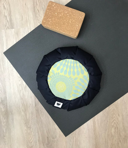 Handcrafted premium cotton canvas meditation seat cushion in solid navy blue and green, grey-blue and silver shot mandala center. Align the spine and body in comfort to calm the monkey mind in your meditation practice. Handcrafted in Calgary, Alberta Canada