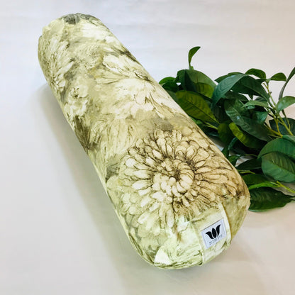 round yoga bolster with floral print in brown and yellow