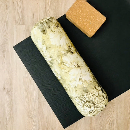 round yoga bolster in yellow and brown floral print