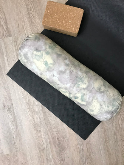 Round yoga bolster in durable poly cotton, in subtle purple marble print fabric. Allergy conscious fill with removeable cover. Made in Canada by My Yoga Room Elements