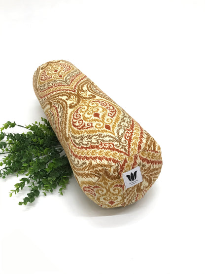 Round yoga bolster in durable cotton canvas, orange and red ikat print fabric. Allergy conscious fill with removeable cover. Made in Canada by My Yoga Room Elements