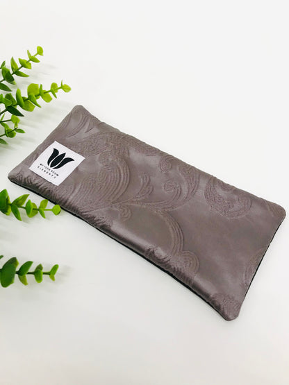 Yoga eye pillow, unscented, therapeutically weighted to soothe eye strain and stress or enhance your savasana. Handcrafted in Canada by My Yoga Room Elements. Purple embossed satin print and bamboo fabric.