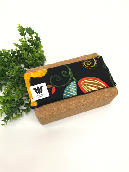 Yoga eye pillow, unscented, therapeutically weighted to soothe eye strain and stress or enhance your savasana. Handcrafted in Canada by My Yoga Room Elements. Rainbow black nature print and bamboo fabric.