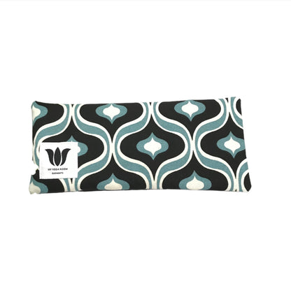 Yoga eye pillow, unscented, therapeutically weighted to soothe eye strain and stress or enhance your savasana. Handcrafted in Canada by My Yoga Room Elements. Black and turquoise mcm print and bamboo fabric.