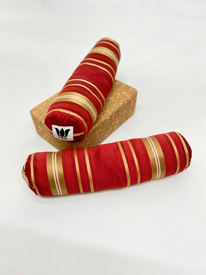 Mini yoga bolster in durable fabric, red gold stripe fabric. Cushion and support the body in the practice of yoga and meditation.Removeable cover. Made in Canada by My Yoga Room Elements