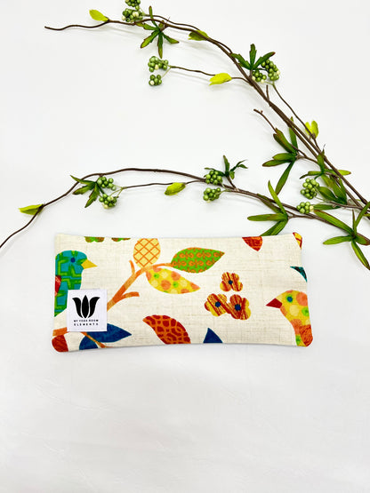 Yoga eye pillow, unscented, therapeutically weighted to soothe eye strain and stress or enhance your savasana. Handcrafted in Canada by My Yoga Room Elements. Rainbow natural print and bamboo fabric.