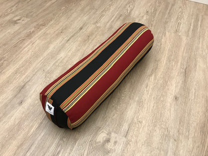 Round yoga bolster in cotton canvas, strip fabric in black, red, beige and gold fabric. Allergy conscious fill with removeable cover. Made in Canada by My Yoga Room Elements